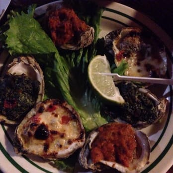 Half Shell Raw Bar - Oyster sampler. Andouille sausage, Rockefeller, and garlic cream. Andouille are BOMB! - Seafood Near Me - Key West, Florida Half Shell Raw Bar - Oyster sampler. Andouille sausage, Rockefeller, and garlic cream. Andouille are BOMB! - Seafood Near Me - Key West, Florida