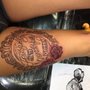 Photo of Red Octopus Tattooing