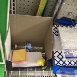 Dollar General - Trash can be found while seeking office supplies.