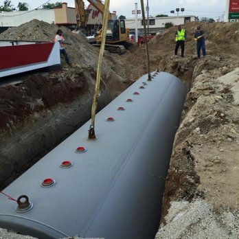 Amyx Contracting - workers working on a large pipe - General Contractors Near Me - Florence , Texas Amyx Contracting - workers working on a large pipe - General Contractors Near Me - Florence , Texas