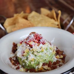 Tacocraft Taqueria & Tequila Bar - Guacamole with corn, bacon bits, and cotija cheese