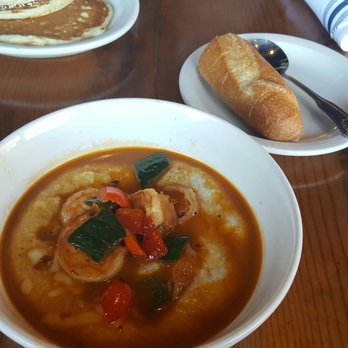 Ria's Bluebird - Shrimp & Grits served with a baguette - Southern Near Me - Atlanta, Georgia