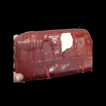 Mark Marvin Leathers - Before picture of a ripped prada purse - Leather Goods Near Me Mark Marvin Leathers - Before picture of a ripped prada purse - Leather Goods Near Me