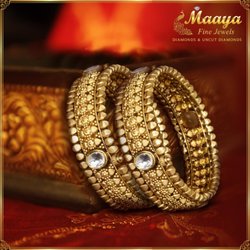 Designer Gold Bangles with a antique finish in 22 Karat Gold