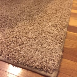 Very soft tan area rug.