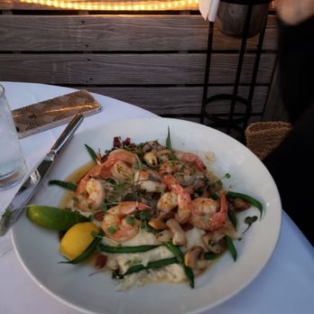 Louie's Backyard - Shrimp and grits. - New American Near Me - Key West, Florida