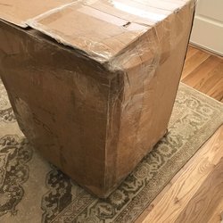 UPS Customer Center - The side was split open, then resealed somewhere along the way...