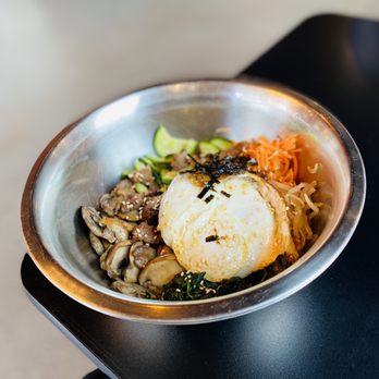 Whistle Pig Korean - a bowl of food on a table - Korean Near Me - Bozeman, Montana Whistle Pig Korean - a bowl of food on a table - Korean Near Me - Bozeman, Montana