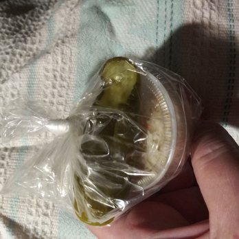 Cross Bay Diner - Recycled bitten pickle included with my hamburger deluxe takeout order. - American Near Me - Howard Beach, New York Cross Bay Diner - Recycled bitten pickle included with my hamburger deluxe takeout order. - American Near Me - Howard Beach, New York