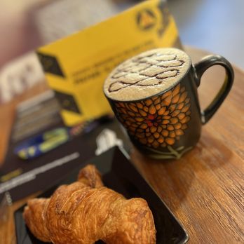 Sugar & Rhyme coffeehouse - Chocolate Cashew latte with croissant - Coffee & Tea Near Me - Elgin, Illinois Sugar & Rhyme coffeehouse - Chocolate Cashew latte with croissant - Coffee & Tea Near Me - Elgin, Illinois