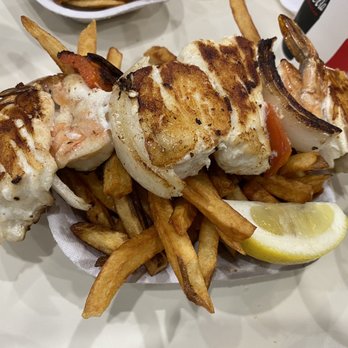 Sunfish - Sunfish special. Fresh prawns, halibut, sweet grilled onion/red peppers over a bed of hot fries - Seafood Near Me - Seattle, Washington Sunfish - Sunfish special. Fresh prawns, halibut, sweet grilled onion/red peppers over a bed of hot fries - Seafood Near Me - Seattle, Washington