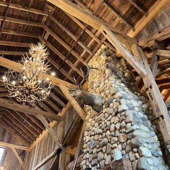 Nick's Pizza & Pub - a stone fireplace and chandelier - Pizza Near Me - Elgin, Illinois Nick's Pizza & Pub - a stone fireplace and chandelier - Pizza Near Me - Elgin, Illinois