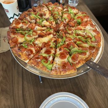 Mountain Mike's Pizza - Famous Curly Pepperoni pizza with bell peppers. - Chicken Wings Near Me - Manor, Texas Mountain Mike's Pizza - Famous Curly Pepperoni pizza with bell peppers. - Chicken Wings Near Me - Manor, Texas