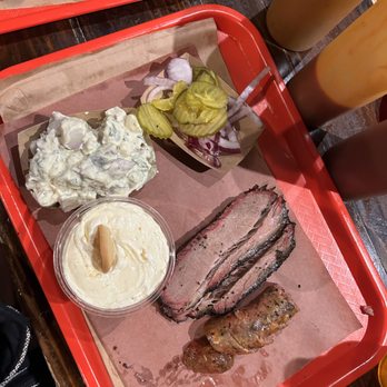 Terry Black's Barbecue - Potato salad, pickles/onions, banana pudding, brisket and cheese sausage - Barbeque Near Me - Austin, Texas Terry Black's Barbecue - Potato salad, pickles/onions, banana pudding, brisket and cheese sausage - Barbeque Near Me - Austin, Texas