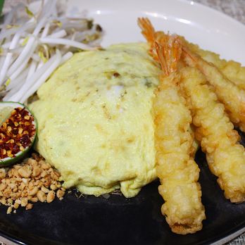 Samila Thai Fusion Cuisine - Samila Pad Thai (Pad Thai wrapped in an omelet with shrimp tempura - Thai Near Me - Chicago, Illinois Samila Thai Fusion Cuisine - Samila Pad Thai (Pad Thai wrapped in an omelet with shrimp tempura - Thai Near Me - Chicago, Illinois