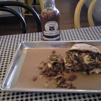 Stack City BBQ & Beer - Partway through The Donk, with Backyard Red bbq sauce in the background... excellent sauce! - Barbeque Near Me - Austin, Texas Stack City BBQ & Beer - Partway through The Donk, with Backyard Red bbq sauce in the background... excellent sauce! - Barbeque Near Me - Austin, Texas