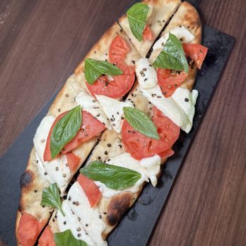 MIX - a flatbread pizza with tomatoes and cheese - Bowling Near Me - Mount Pleasant, South Carolina MIX - a flatbread pizza with tomatoes and cheese - Bowling Near Me - Mount Pleasant, South Carolina
