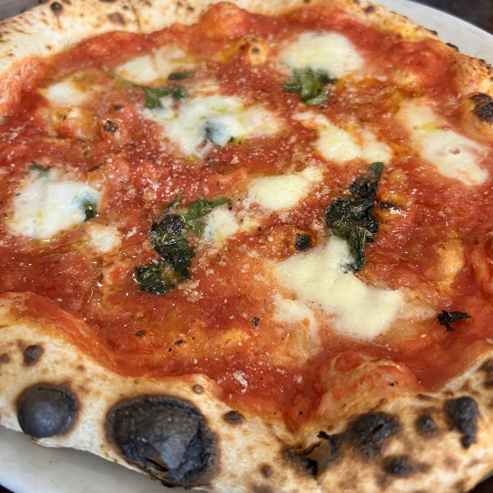 Caffè Calabria - Margherita D.O.C.
organic San Marzano tomatoes, basil, grana, and mozzarella di bufala - Coffee & Tea Near Me - San Diego, California Caffè Calabria - Margherita D.O.C.
organic San Marzano tomatoes, basil, grana, and mozzarella di bufala - Coffee & Tea Near Me - San Diego, California
