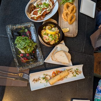 Vendricks - calamari, prawns pil pil, kerry lamb and leek spring roll, patatas bravas, and goat cheese and ratatouille tartlet - Tapas/Small Plates Near Me - Killarney, Kentucky Vendricks - calamari, prawns pil pil, kerry lamb and leek spring roll, patatas bravas, and goat cheese and ratatouille tartlet - Tapas/Small Plates Near Me - Killarney, Kentucky