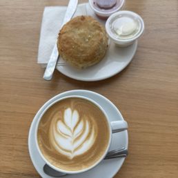 Biscuit with butter and house made jam and a salted caramel cappuccino