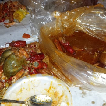 Crackin Crawfish - The aftermath. Clams were huge! Combo 3 and a side of rice. - Cajun/Creole Near Me - Charlotte, North Carolina Crackin Crawfish - The aftermath. Clams were huge! Combo 3 and a side of rice. - Cajun/Creole Near Me - Charlotte, North Carolina