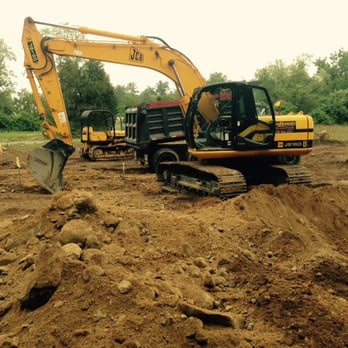 J.E.B. Building & Remodeling - excavators in a field - General Contractors Near Me J.E.B. Building & Remodeling - excavators in a field - General Contractors Near Me