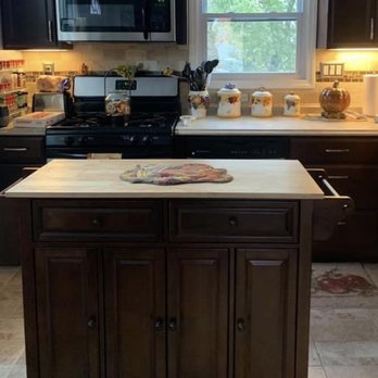 Rent A Hubby - a kitchen with a stove, microwave, and island - Handyman Near Me Rent A Hubby - a kitchen with a stove, microwave, and island - Handyman Near Me