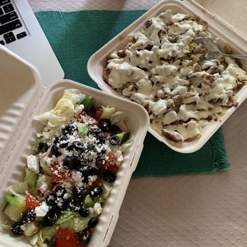 Osmow's Shawarma - two takeout containers of food and a laptop - Mediterranean Near Me - Peterborough, Ontario Osmow's Shawarma - two takeout containers of food and a laptop - Mediterranean Near Me - Peterborough, Ontario