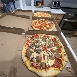 Patronies Pizza - Supreme, pepperoni, and White Pizza. Fed 9. We were super happy.