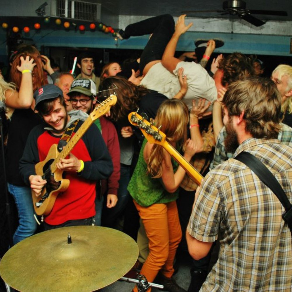 a crowd of people playing music a crowd of people playing music