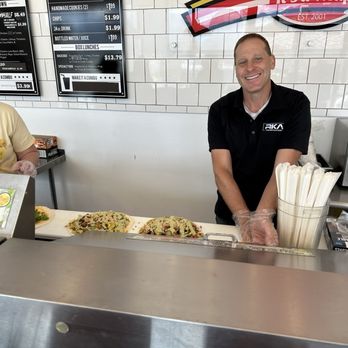 Wriggles - The magic behind the bar. Turkey Bacon Wraps in the works. - Delis Near Me - Murray, Utah Wriggles - The magic behind the bar. Turkey Bacon Wraps in the works. - Delis Near Me - Murray, Utah