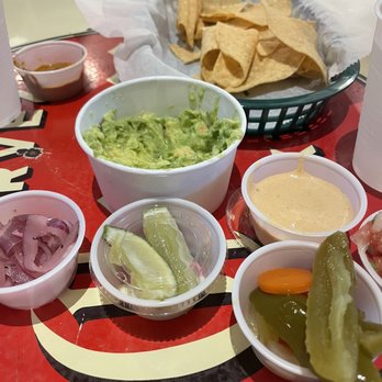 The Taco Stand - Guacamole and chips with sauces from the sauce bar - Mexican Near Me - Miami, Florida The Taco Stand - Guacamole and chips with sauces from the sauce bar - Mexican Near Me - Miami, Florida