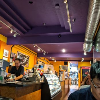 Silvestre Deli & Bistro - a man sitting at a counter - Peruvian Near Me - Vancouver, British Columbia Silvestre Deli & Bistro - a man sitting at a counter - Peruvian Near Me - Vancouver, British Columbia