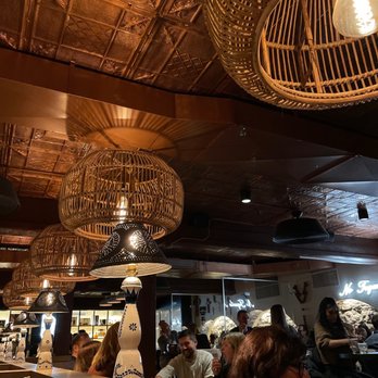 Anejo - a crowded restaurant with people sitting at tables - Bars Near Me - Toronto, Ontario
