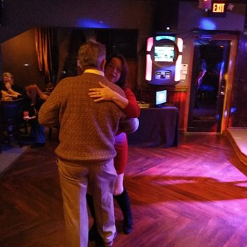 Shannon's - a man and a woman dancing in a club - Bars Near Me - Augusta, Georgia