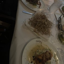 Filet mignon (far), shoestring potatoes (middle), salmon (close)