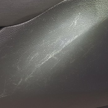 Diversified Creation - Close-up of door-panel damage - Auto Parts & Supplies Near Me - Brighton, Michigan