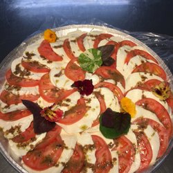 Southoldwaysidemarket - Tomato and fresh mozzarella platter made with edible flowers and fresh opal basil from our Store Garden.
