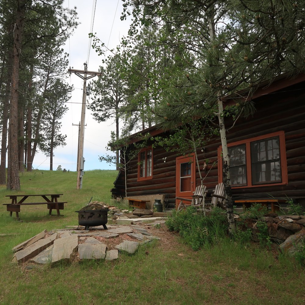 Camp Custer Log Cabins - Pinecrest Cabin. Fire pit, gas grill, picnic table seating and stonework. - Vacation Rentals Near Me - Custer, South Dakota Camp Custer Log Cabins - Pinecrest Cabin. Fire pit, gas grill, picnic table seating and stonework. - Vacation Rentals Near Me - Custer, South Dakota
