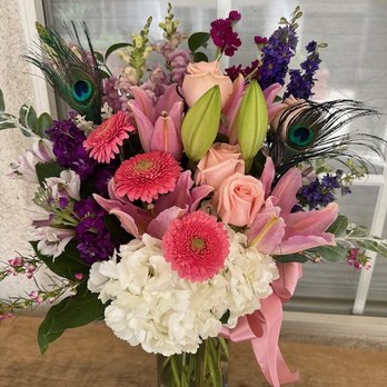 Sami's Flowers - Spring mix with peacock feathers - Florists Near Me - Mission Viejo, California Sami's Flowers - Spring mix with peacock feathers - Florists Near Me - Mission Viejo, California