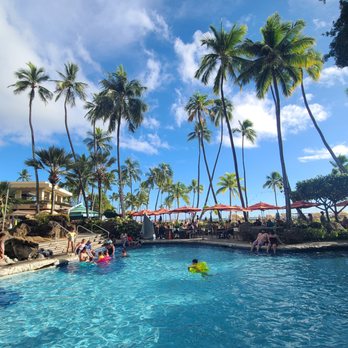 Hau Tree Bar - the seating area for Hau Tree is right next to the pool - Local Flavor Near Me - Honolulu, Hawaii