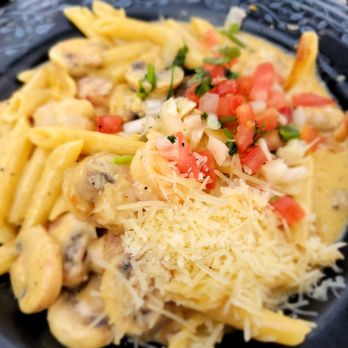 Tecate Grill - a plate of pasta with mushrooms and tomatoes - Mexican Near Me - Spokane, Washington
