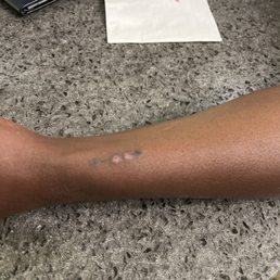 arrow and heart tattoo done by Floyd