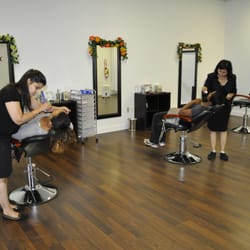 Elegant Eyebrow Threading - Two beautiful ladies busy in customer service...