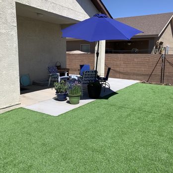 ABQ Landscaping - a patio with a blue umbrella - Landscaping Near Me - Albuquerque, New Mexico