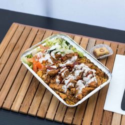 Goubaa Grub - Mediterranean Grilled Chicken   rice & salad over Goubaa grub sauce and Garlic aioli