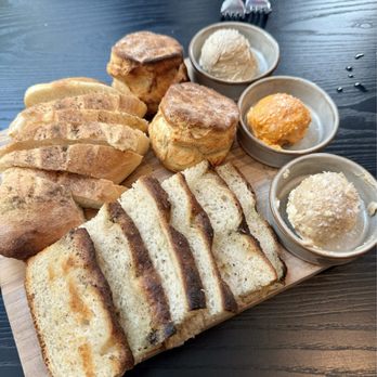 Café Momentum - Pittsburgh - Butter board with focaccia, sourdough, and biscuits and three house made butters (garlic miso, Korean gochujang, and amaretto fig) - Community Service/Non-Profit Near Me - Pittsburgh, Pennsylvania
