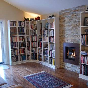 Skanes General Contracting - Den renovation with new flooring, gas fireplace, and library. A bit of work turns Ikea bookcases into a custom built in library - Decks & Railing Near Me Skanes General Contracting - Den renovation with new flooring, gas fireplace, and library. A bit of work turns Ikea bookcases into a custom built in library - Decks & Railing Near Me