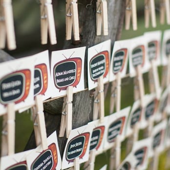 Trightymite Event Lighting & Decor - Dan came up with the idea to do guests names in the TVs and hung all the names on a wagon with these cloths pins. - Party & Event Planning Near Me - Santa Clarita, California