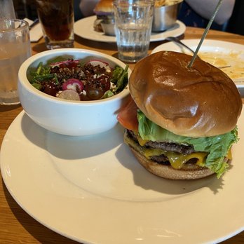 Earls Kitchen + Bar - Bacon Cheddar Burger with side of mixed greens salad - New American Near Me - Somerville, Massachusetts Earls Kitchen + Bar - Bacon Cheddar Burger with side of mixed greens salad - New American Near Me - Somerville, Massachusetts